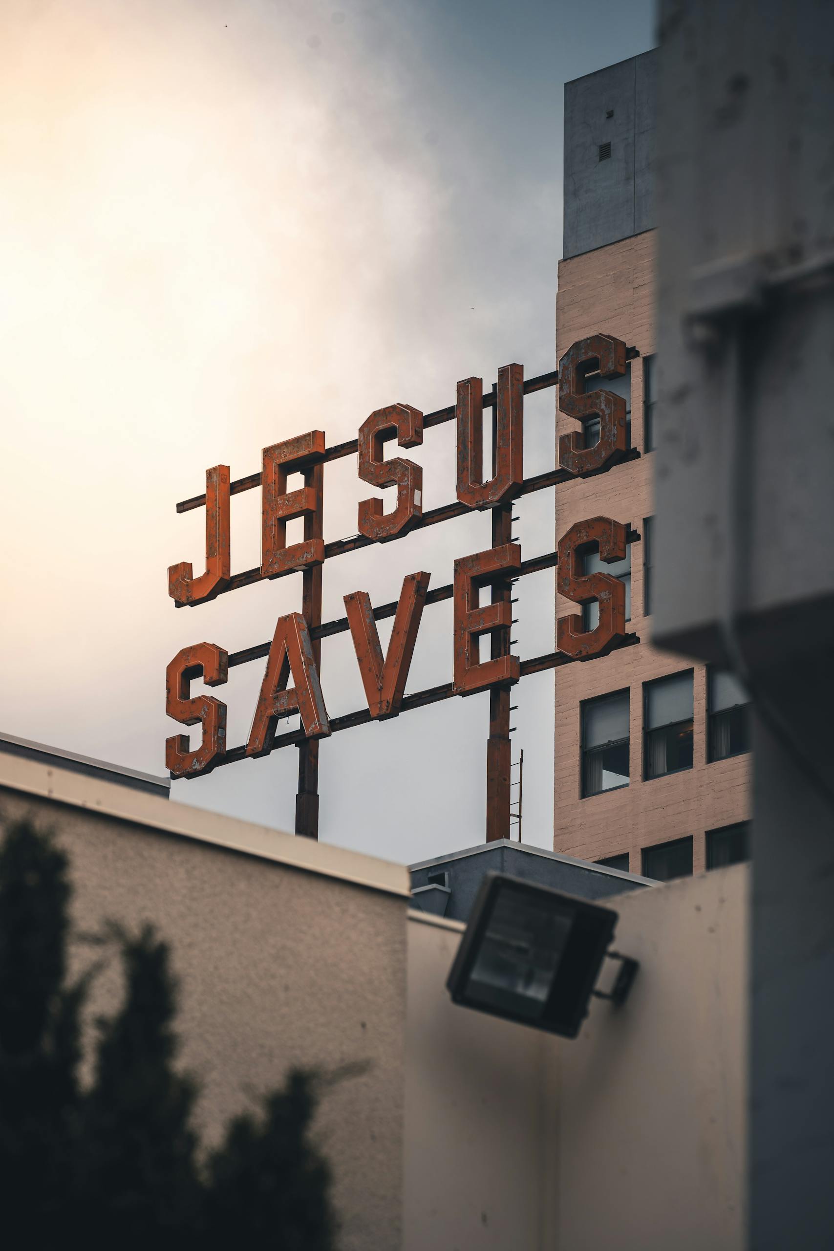 A striking view of the Jesus Saves sign against the Los Angeles skyline.